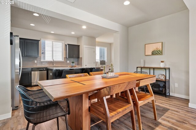 14139 SW Burlwood Ln, Beaverton, OR 97005 - dining room with light wood-style floors, healthy amount of natural light, and recessed lighting