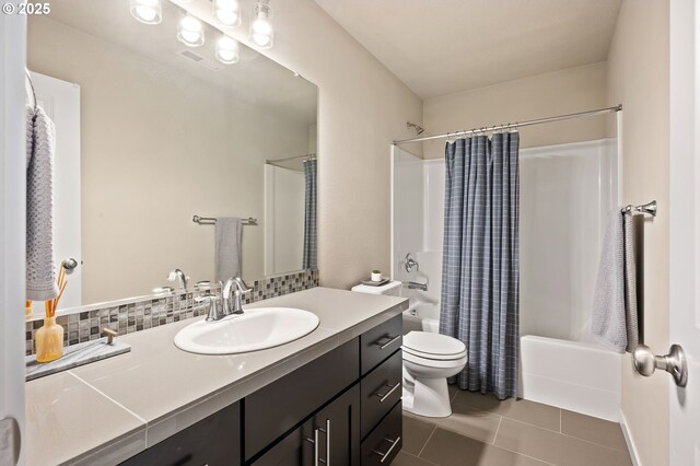 14139 SW Burlwood Ln, Beaverton, OR 97005 - full bathroom with vanity, shower / bath combo with shower curtain, tile patterned flooring, and tasteful backsplash