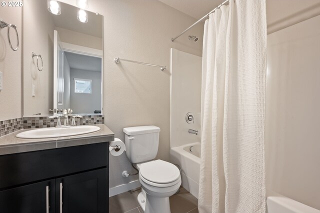 14139 SW Burlwood Ln, Beaverton, OR 97005 - bathroom featuring shower / bath combo with shower curtain, vanity, tasteful backsplash, and tile patterned floors