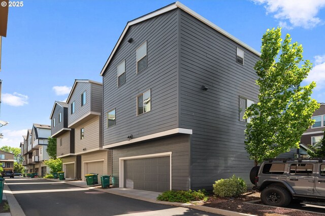 14139 SW Burlwood Ln, Beaverton, OR 97005 - view of home's exterior featuring an attached garage and a residential view