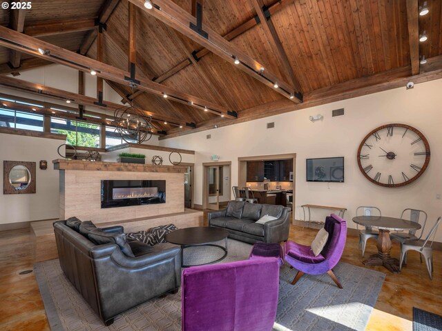 14139 SW Burlwood Ln, Beaverton, OR 97005 - living area featuring a wooden ceiling with exposed beams, a glass covered fireplace, high vaulted ceiling, and rail lighting