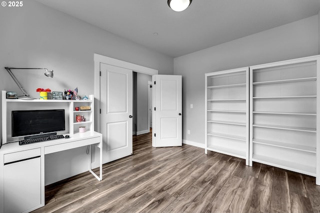 office space featuring wood finished floors and baseboards