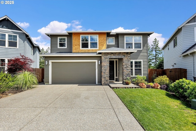 view of front of house with an attached garage, driveway, and stone siding