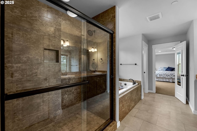 full bathroom featuring ensuite bath, a shower stall, a bath, tile patterned floors, and double vanity
