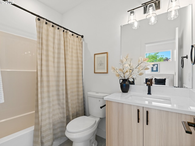 full bath with toilet, vanity, and shower / tub combo