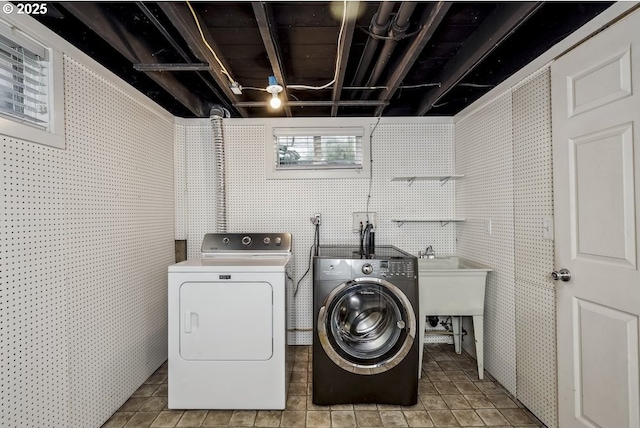 1968 SE 25th Ave, Portland, OR 97214 - washroom featuring washer and clothes dryer, tile walls, and light tile patterned floors