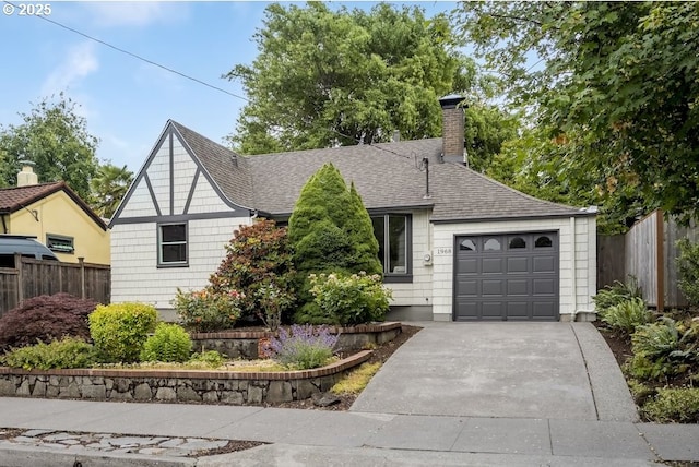 1968 SE 25th Ave, Portland, OR 97214 - view of front facade with a shingled roof, an attached garage, driveway, and a chimney