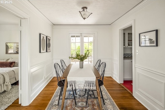 1968 SE 25th Ave, Portland, OR 97214 - dining room with a decorative wall, ornamental molding, a wainscoted wall, and dark wood-type flooring