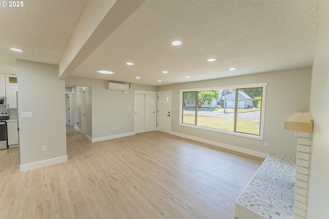 2859 NE 2nd Ave, Camas, WA 98607 - unfurnished living room with a textured ceiling, a wall mounted air conditioner, light wood finished floors, and recessed lighting