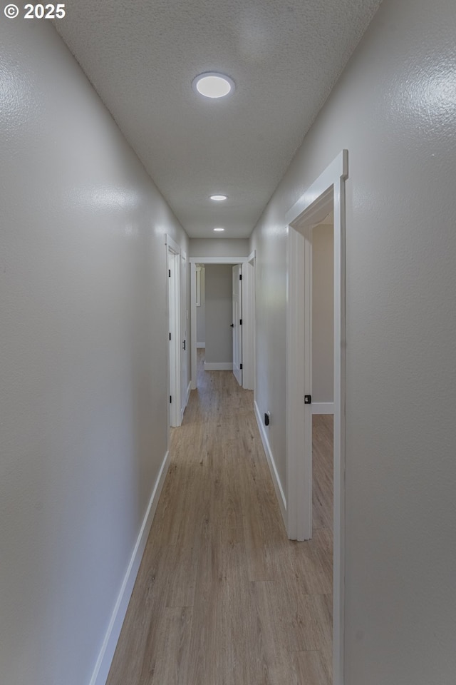 2859 NE 2nd Ave, Camas, WA 98607 - hallway featuring light wood-style floors and a textured ceiling