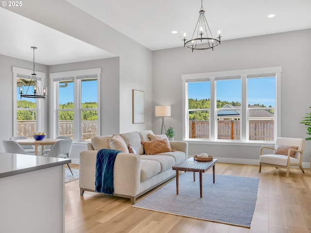 1155 SE Bugle Ave, Warrenton, OR 97146 - living area with a chandelier, healthy amount of natural light, light wood finished floors, and recessed lighting