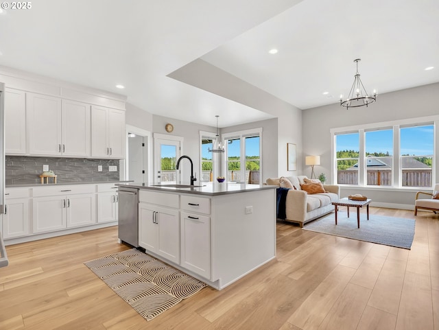 1155 SE Bugle Ave, Warrenton, OR 97146 - kitchen featuring dishwasher, a chandelier, open floor plan, light wood-style floors, and recessed lighting