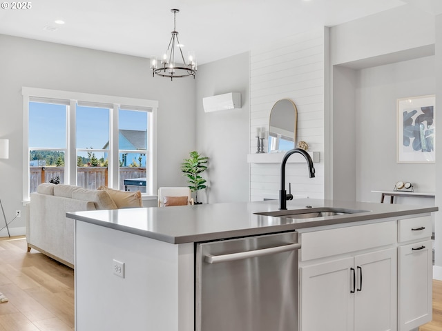 1155 SE Bugle Ave, Warrenton, OR 97146 - kitchen featuring stainless steel dishwasher, white cabinets, a chandelier, light wood-type flooring, and recessed lighting