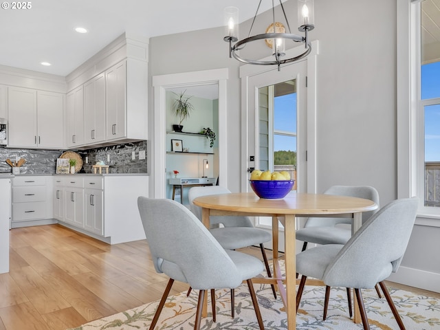 1155 SE Bugle Ave, Warrenton, OR 97146 - dining room featuring a chandelier, light wood-type flooring, and recessed lighting