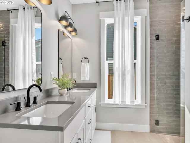 1155 SE Bugle Ave, Warrenton, OR 97146 - bathroom featuring a shower stall, double vanity, and tile patterned floors
