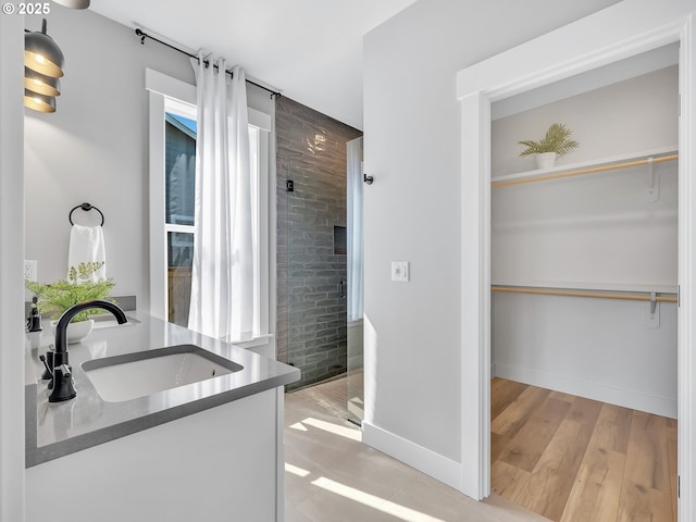 1155 SE Bugle Ave, Warrenton, OR 97146 - bathroom featuring vanity, a stall shower, and a spacious closet