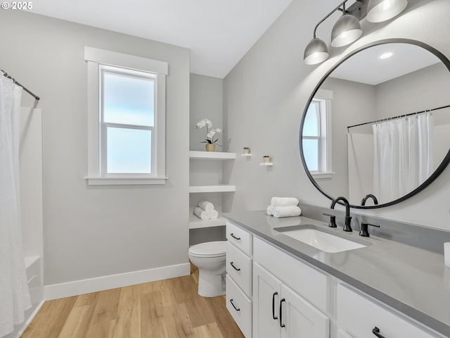 1155 SE Bugle Ave, Warrenton, OR 97146 - full bathroom featuring vanity, wood finished floors, and shower / bathtub combination with curtain