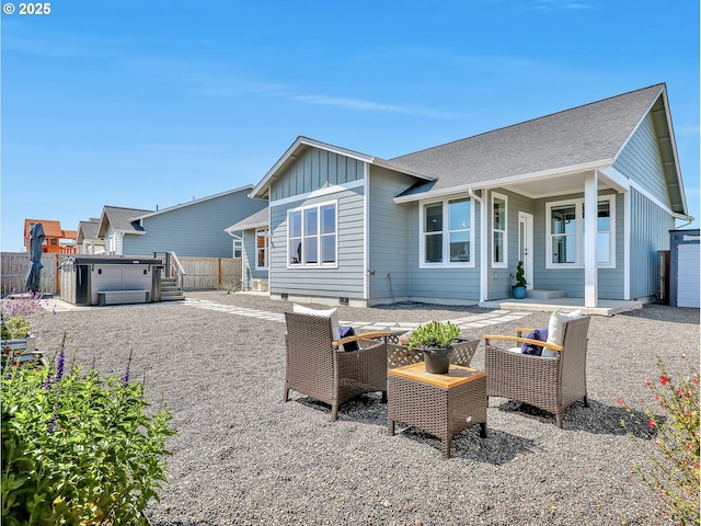 1155 SE Bugle Ave, Warrenton, OR 97146 - back of house with a hot tub and board and batten siding