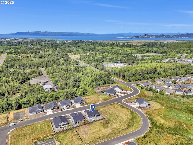 1155 SE Bugle Ave, Warrenton, OR 97146 - aerial view of residential area with mountains and a forest