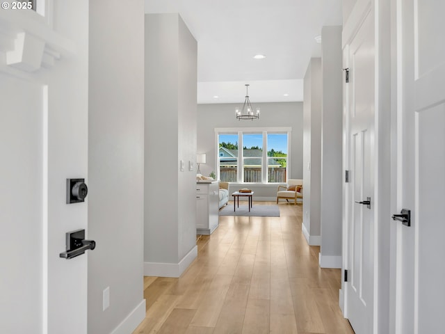1155 SE Bugle Ave, Warrenton, OR 97146 - corridor with a chandelier, recessed lighting, and light wood finished floors
