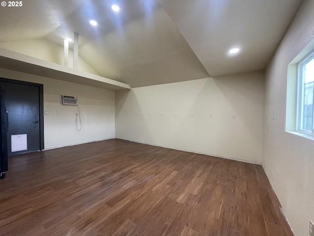 bonus room with recessed lighting, a wall unit AC, wood finished floors, and lofted ceiling