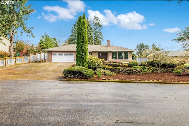 single story home featuring a chimney, driveway, an attached garage, and fence