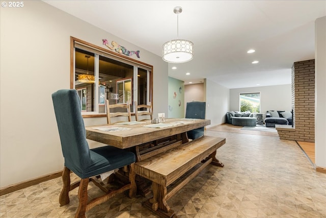 dining area featuring recessed lighting and baseboards