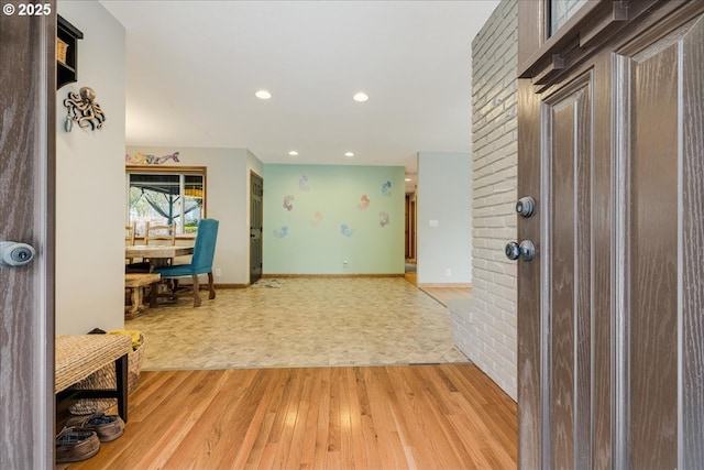 foyer entrance featuring recessed lighting, baseboards, and light wood-type flooring