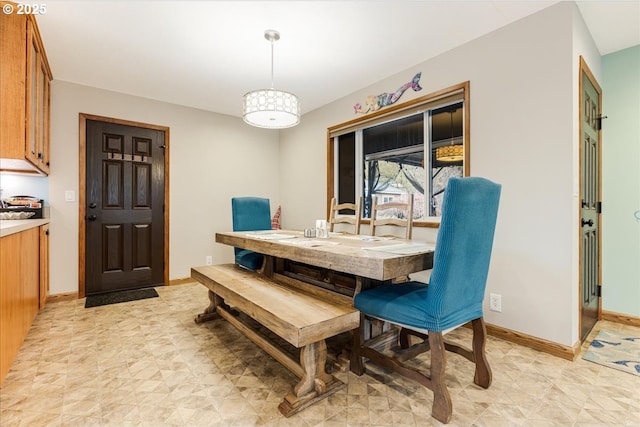 dining area featuring baseboards