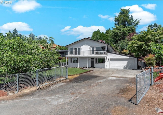 8318 SE Middle Way, Vancouver, WA 98664 - view of front of house with a balcony, driveway, a gate, and a garage