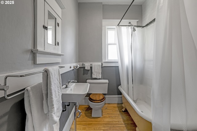 2869 SE Sherman St, Portland, OR 97214 - full bath with wood finished floors and shower / bathtub combination with curtain