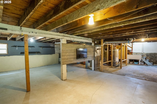 2869 SE Sherman St, Portland, OR 97214 - basement featuring stairway and gas water heater