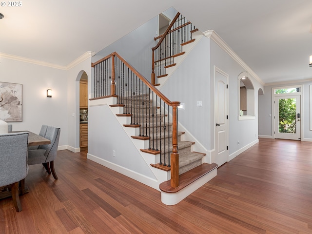 17356 Bryant Rd, Lake Oswego, OR 97035 - stairway with arched walkways, wood finished floors, baseboards, and ornamental molding