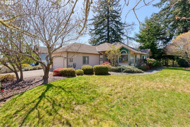 ranch-style house with a front yard, driveway, and a garage