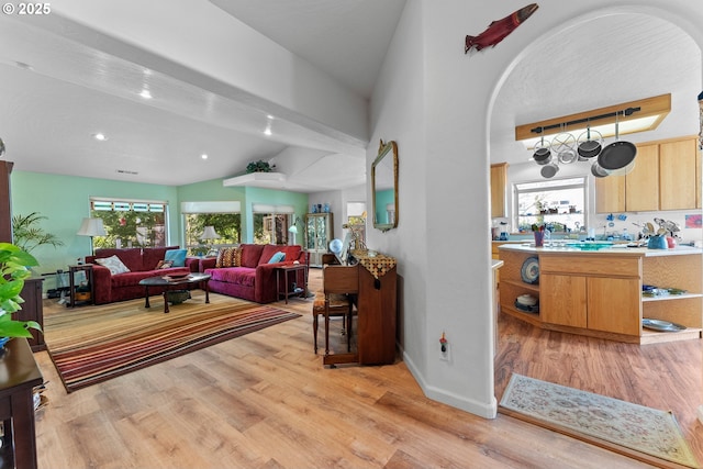 living area featuring recessed lighting, light wood finished floors, and baseboards