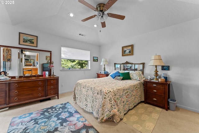 bedroom featuring visible vents, light colored carpet, baseboards, and lofted ceiling