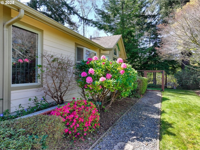 view of side of property featuring a yard