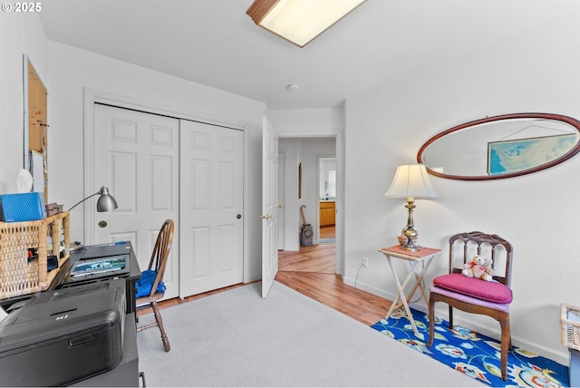 office with baseboards and wood finished floors