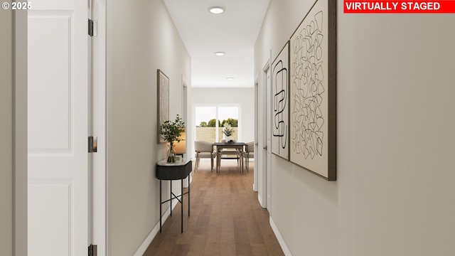 hall featuring recessed lighting, wood finished floors, and baseboards