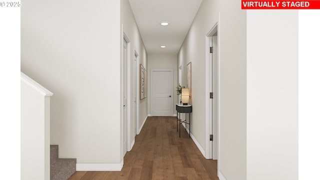 hallway with stairs, recessed lighting, wood finished floors, and baseboards