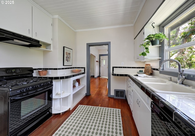 kitchen with black appliances, tile countertops, open shelves, a sink, and white cabinetry