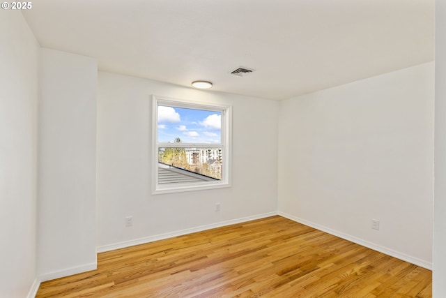 spare room featuring light wood-type flooring