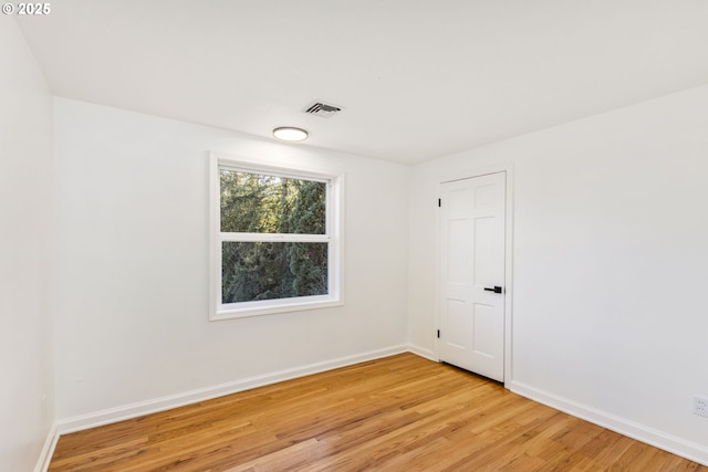 unfurnished room featuring light wood-type flooring