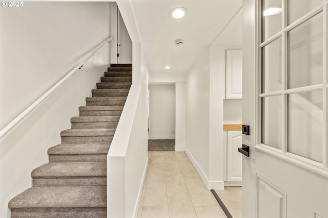 staircase with tile patterned floors