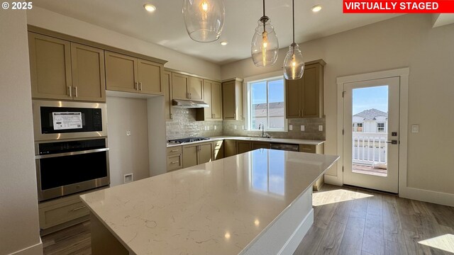 17920 SW Alvord Ln, Beaverton, OR 97007 - unfurnished living room featuring a tiled fireplace, recessed lighting, and dark wood finished floors
