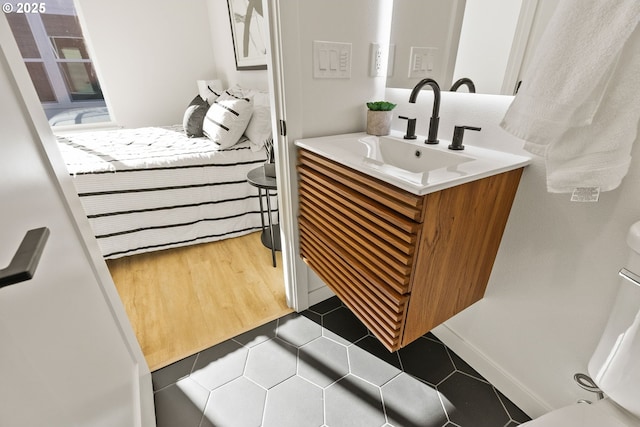 bathroom featuring vanity and wood-type flooring