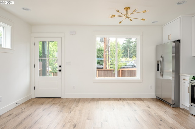 4103 SE Olsen St Unit 8, Milwaukie, OR 97222 - doorway to outside with a chandelier, light wood-style flooring, and recessed lighting