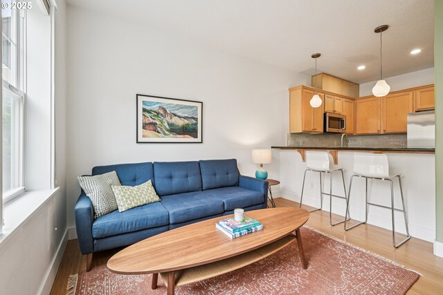727 SE 33rd Pl Unit 21, Portland, OR 97214 - living area with light wood-style flooring, recessed lighting, and baseboards