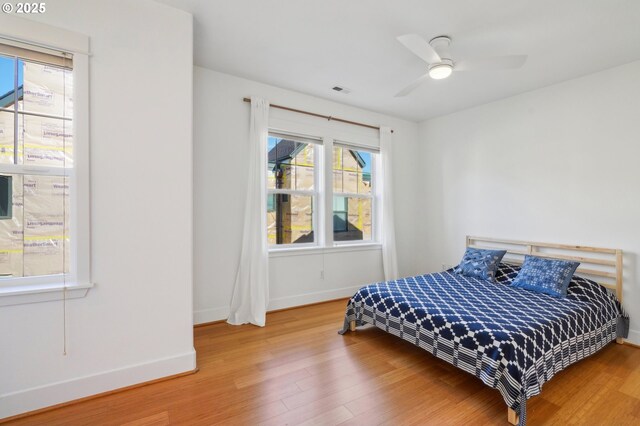 727 SE 33rd Pl Unit 21, Portland, OR 97214 - bedroom with wood finished floors and baseboards