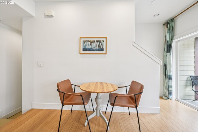 727 SE 33rd Pl Unit 21, Portland, OR 97214 - dining space featuring baseboards and wood finished floors